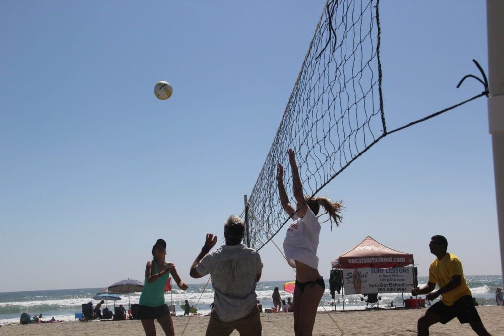 NOVO team playing beach volleyball in Southern California