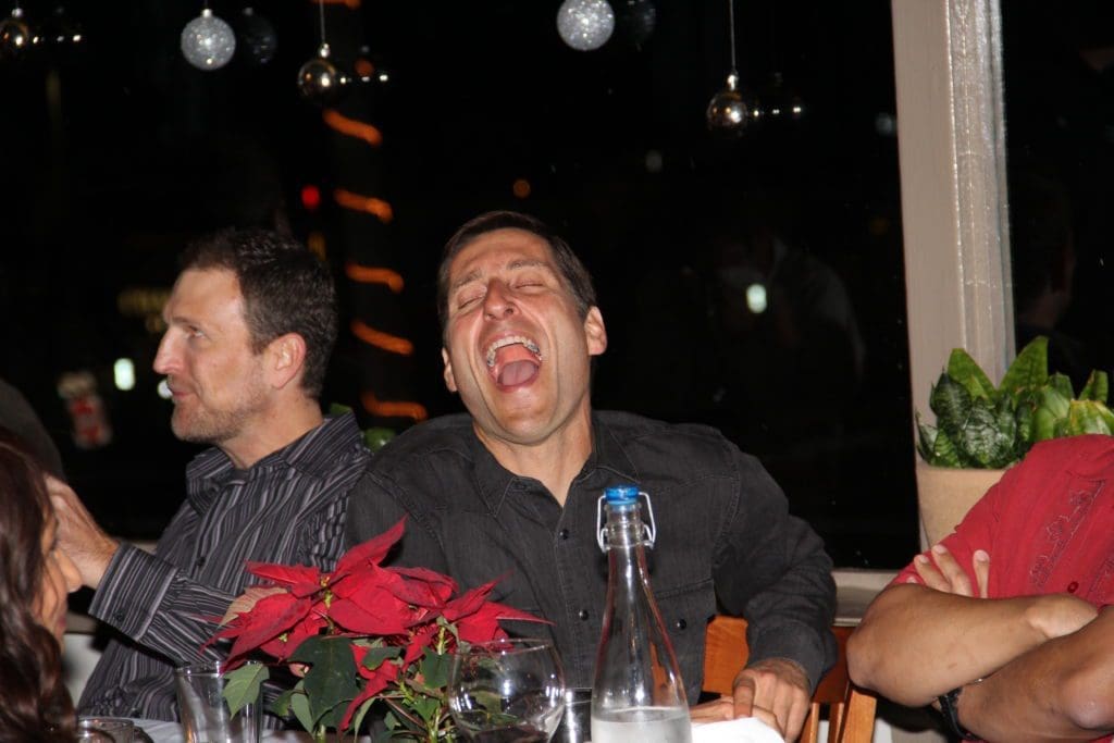 picture of man singing at holiday dinner