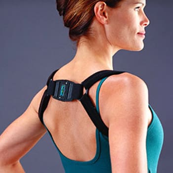 Woman wearing biofeedback posture trainer