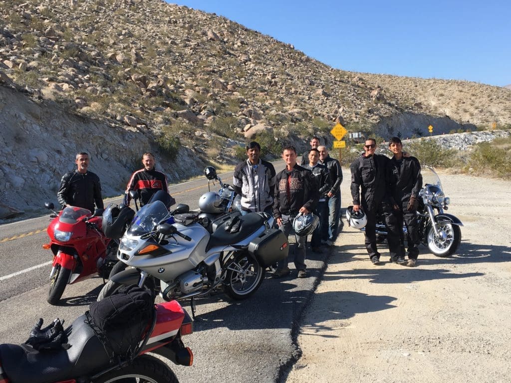 NOVO team on the side of a rural road in California riding motorcycles