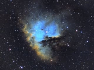 Pacman Nebula 2400 blue and yellow photo of the Pacman Nebula