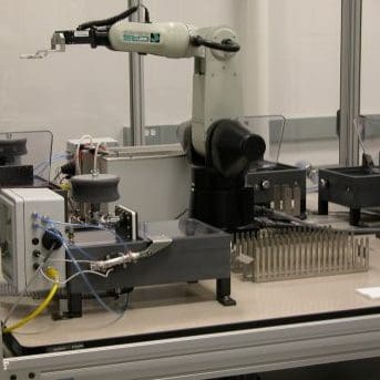 Side view of a custom microplate-cleaning robot